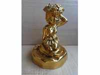 An old gilded ashtray with a figure, statuette, sculpture