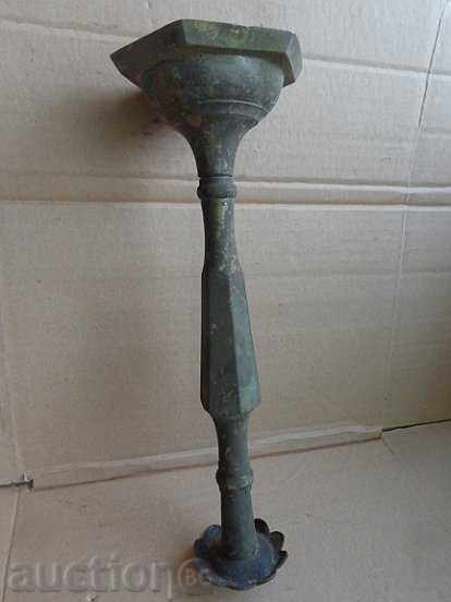 Auction  An Ottoman candlestick with a candle, a candle, a lamp