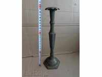 An Ottoman candlestick with a candle, a candle, a lamp