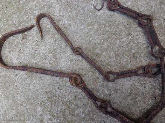 Delivery of Old forged chain with hooks, crochet, hook, wrought iron Delivery of Old forged chain with hooks, crochet, hook, wrought iron