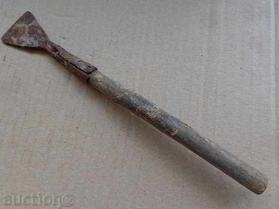 An old metal tool, a gingerbread scraper