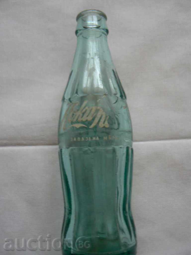 An old bottle of Coca-Cola in Cyrillic