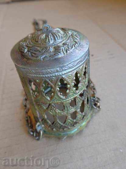 Delivery of An old home-made bronze candela with a glass cup Delivery of An old home-made bronze candela with a glass cup