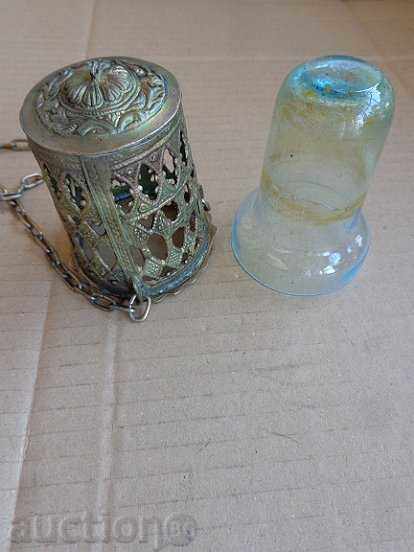Auction An old home-made bronze candela with a glass cup Auction An old home-made bronze candela with a glass cup