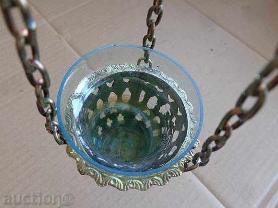 Delivery of An old home-made bronze candela with a glass cup Delivery of An old home-made bronze candela with a glass cup