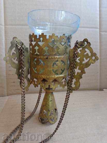 Delivery of An old homemade Russian bronze candlestick with a glass cup Delivery of An old homemade Russian bronze candlestick with a glass cup