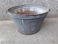 An old galvanized basin, a trough, a household pot