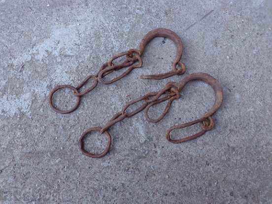 Delivery of Old hand-forged shackles, chains, fetters, iron shackles Delivery of Old hand-forged shackles, chains, fetters, iron shackles