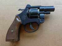 A toy revolver, a gun with a gun, a pistol works