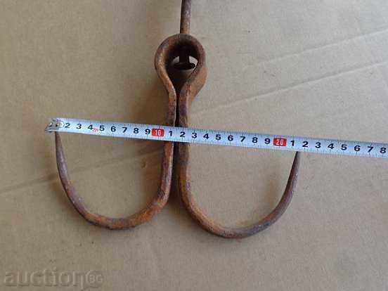 Delivery of An old forged hook for scraping, a crown Delivery of An old forged hook for scraping, a crown