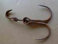 An old forged hook for scraping, a crown