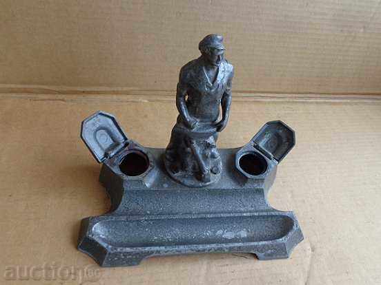 An inkwell with a figure of a blacksmith, a wounded social worker statuette of the NRB BKP with price 129.00 BGN | € 65.96 An inkwell with a figure of a blacksmith, a wounded social worker statuette of the NRB BKP with price 129.00 BGN | € 65.96