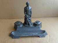 An inkwell with a figure of a blacksmith, a wounded social worker statuette of the NRB BKP