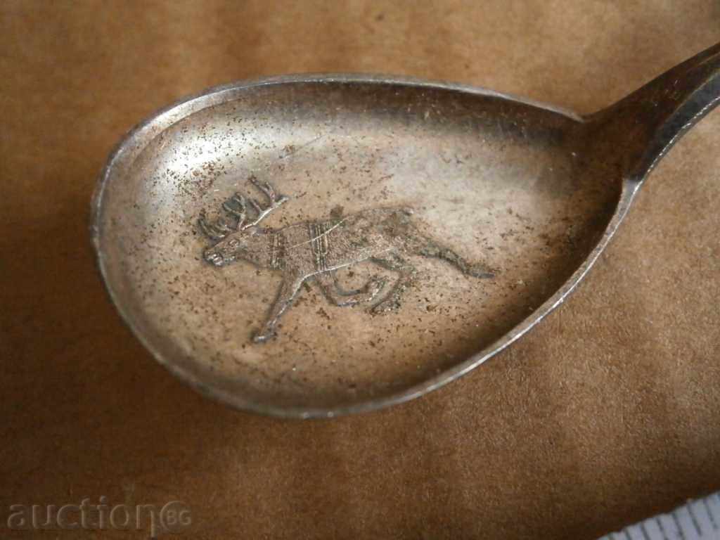 Auction  a corkscrew and a silver spoon