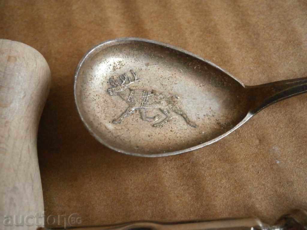 a corkscrew and a silver spoon - 6