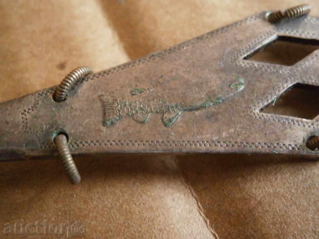 a corkscrew and a silver spoon - 7