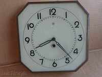 Old wall clock wounded