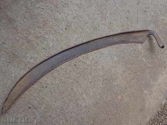 Old hand-forged mowing hair, wrought iron