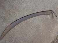 Old hand-forged mowing hair, wrought iron