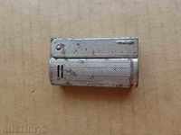 An old gas lighter works