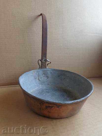 An old copper pan, a baker, a tray, a copper pot An old copper pan, a baker, a tray, a copper pot