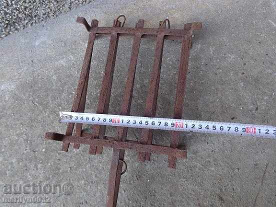 Delivery of An old hand-forged grill, a steak, wrought iron Delivery of An old hand-forged grill, a steak, wrought iron