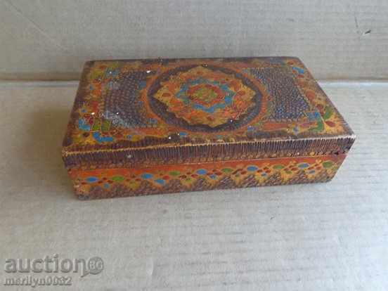 An old pyrographic wooden box hand-painted