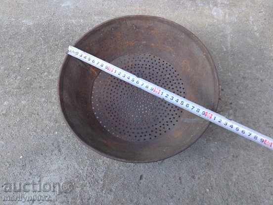Delivery of An old metal sieve