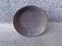 An old metal sieve
