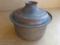 An old saucepan, a baker's copper pot with lid