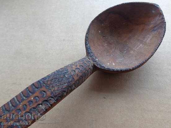 Delivery of Very old wooden spoon, ladle, wooden