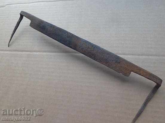 Old rusty wrought iron tool Old rusty wrought iron tool