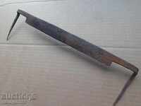 Old rusty wrought iron tool