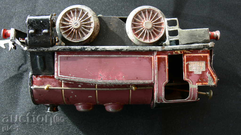 Delivery of An ancient large metal locomotive Delivery of An ancient large metal locomotive