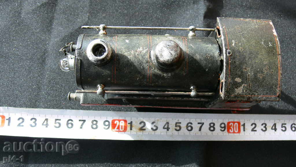 An ancient large metal locomotive with price 100.00 BGN | € 51.13