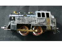 An ancient large metal locomotive