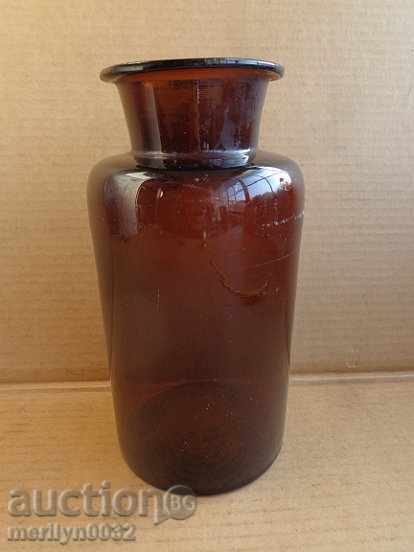 An old glass jar of glass bottles