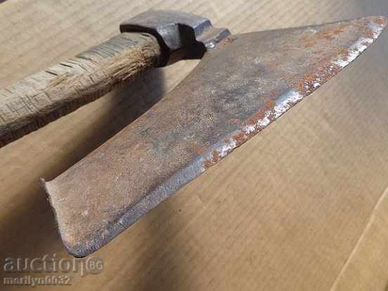 Delivery of An old ax, a curve with a print of a toothed toothed saddle hat Delivery of An old ax, a curve with a print of a toothed toothed saddle hat