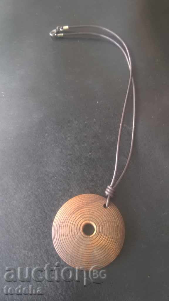 AMULET Medallion wood leather with price 3.00 BGN | € 1.53 AMULET Medallion wood leather with price 3.00 BGN | € 1.53