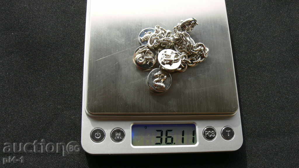 Auction An old massive bracelet with a zodiac Auction An old massive bracelet with a zodiac