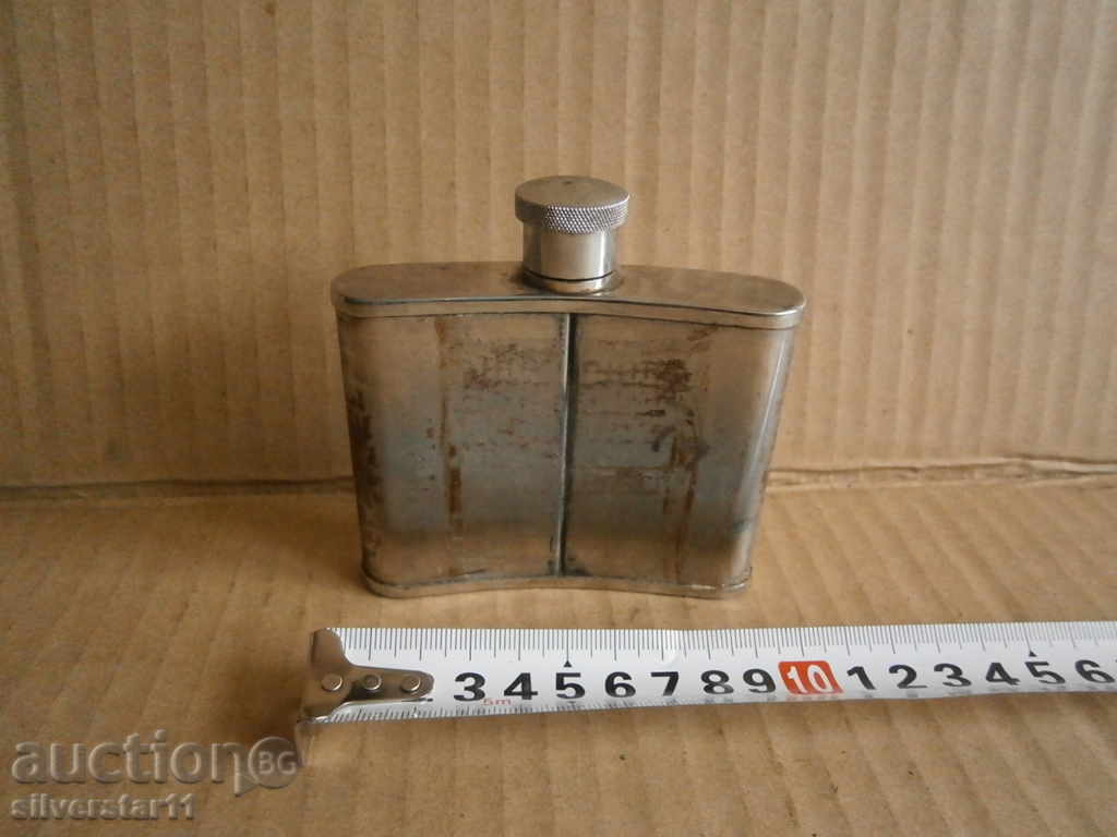 Auction a small metal bottle for alcohol Auction a small metal bottle for alcohol