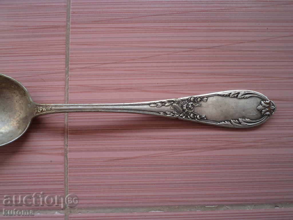 Auction Serrated large spoon with markings Auction Serrated large spoon with markings