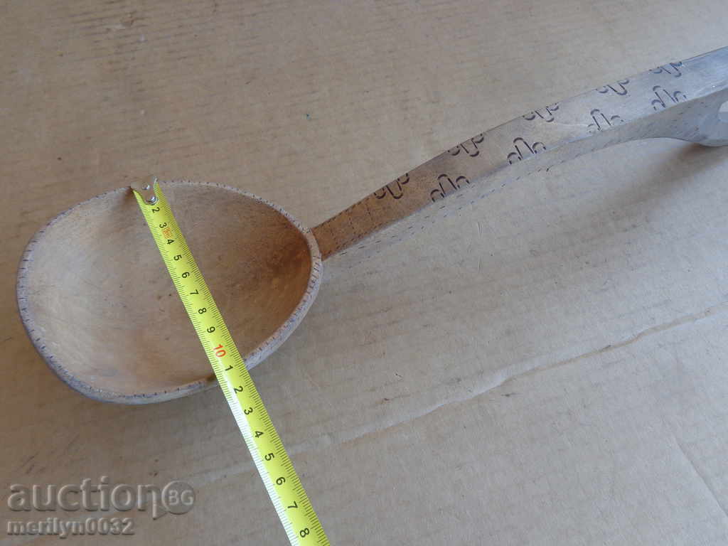 Delivery of Very old wooden spoon, ladle, wooden