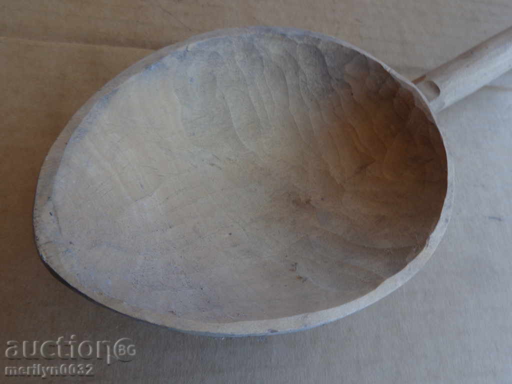Delivery of Very old wooden spoon, ladle, wooden