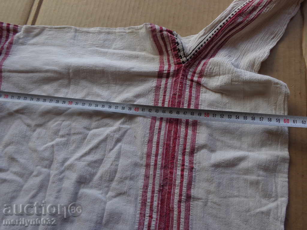 Auction An old hand-woven kennel shirt, a sukmann dress Auction An old hand-woven kennel shirt, a sukmann dress
