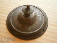 an old bronze cover of a sugar bowl