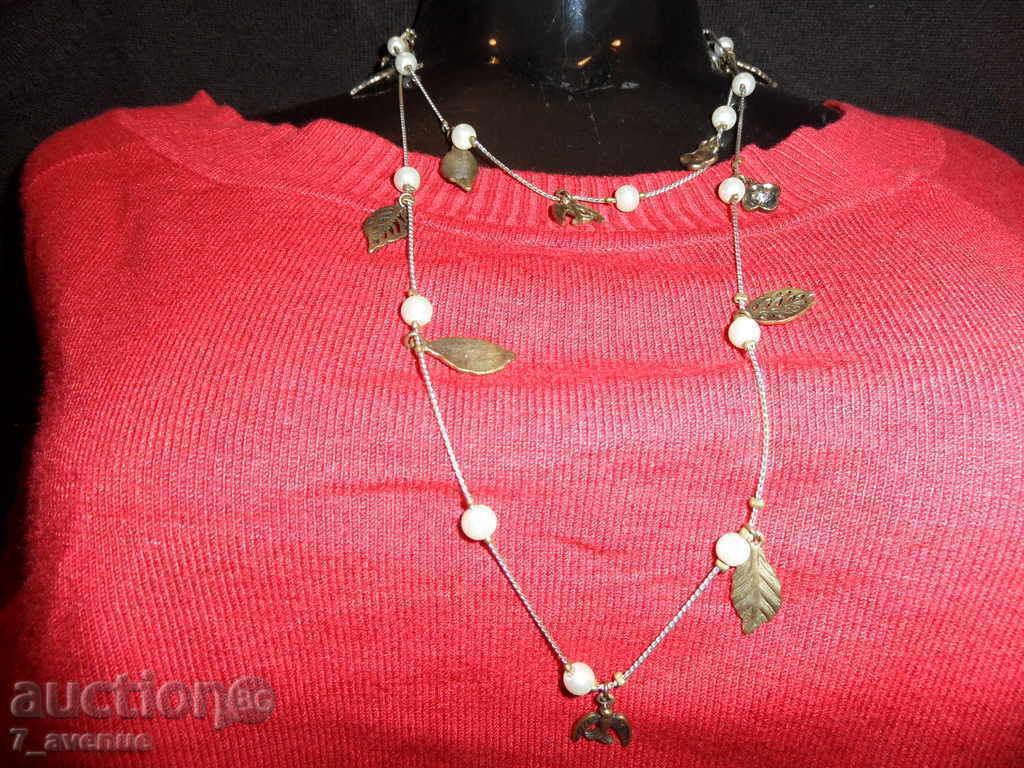 Δημοπρασία ΚΟΛΙΕ με πέρλες, πέταλα, χελιδόνια δ-α 100 εκ.