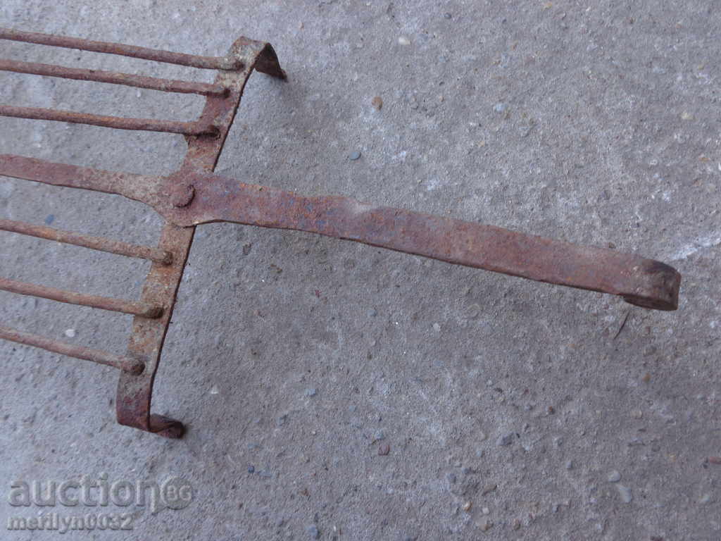 Auction  An old hand-forged grill, a steak, wrought iron