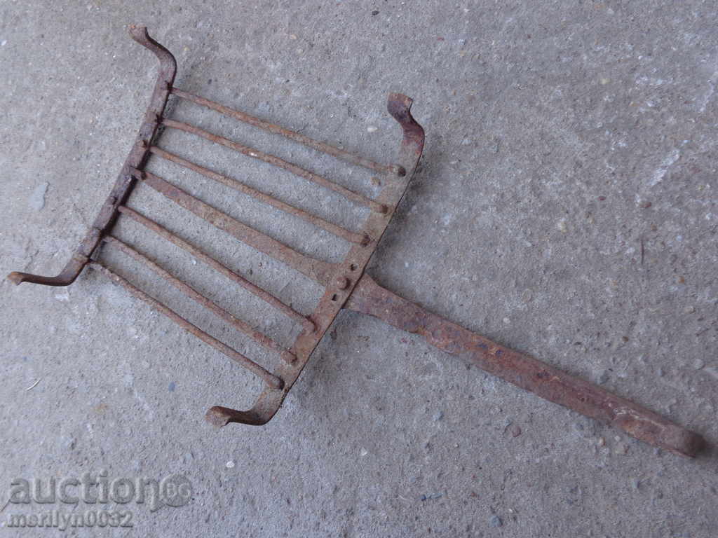 Delivery of An old hand-forged grill, a steak, wrought iron