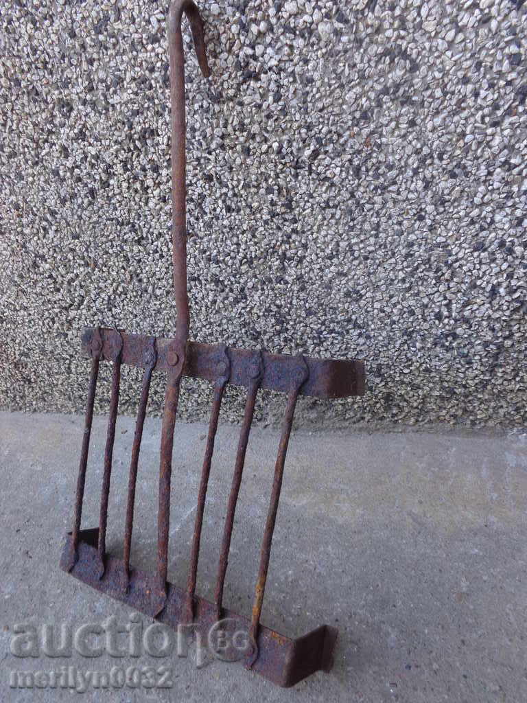 Auction  An old hand-forged grill, a steak, wrought iron